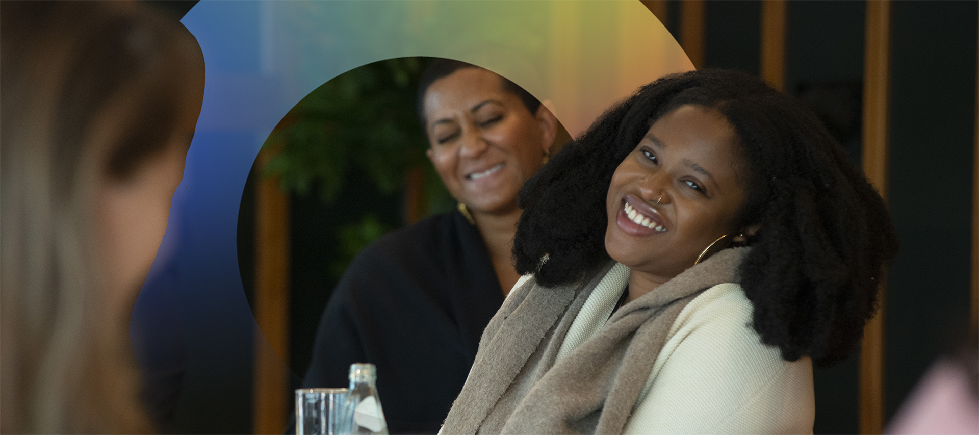 Two women laugh at 2023 NIL launch.